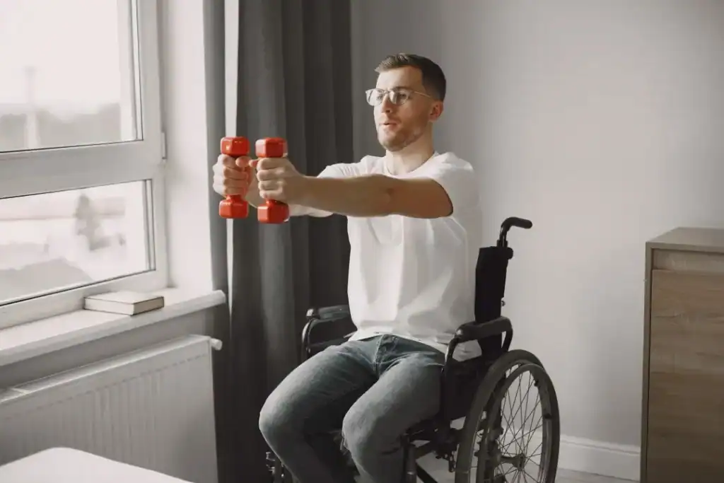 Image of man doing exercise in his wheelchair to aid weight loss Ashford