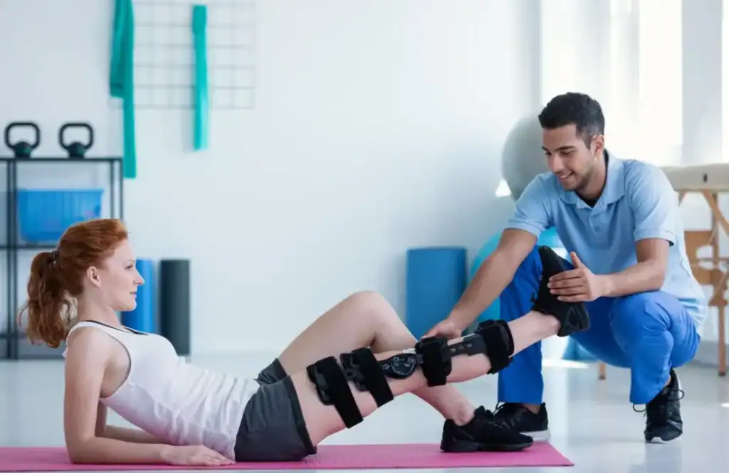 Debunking Meal Timing Myths: The Truth About Muscle Recovery 1 Woman having treatment to help muscle recovery Ashford after an injury