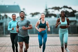 Sculpting Sleek Arms: The Essential Role of Cardio in Toning Without Bulking Up 3 image of people running to incorporate cardio Ashford exercise into their life to help tone arms and body.